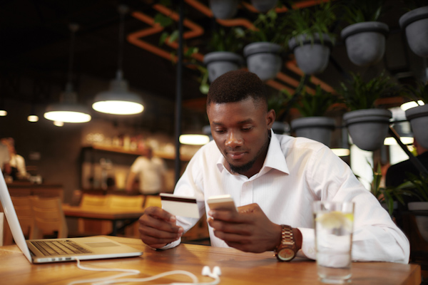 A business man using a MyPayment.Expert MasterCard