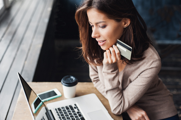 A business lady holding a MyPayment.Expert MasterCard
